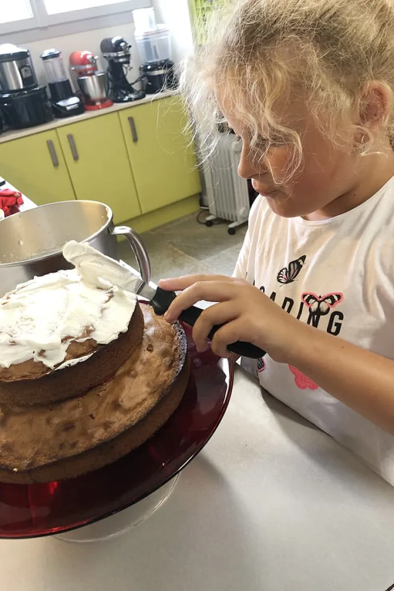 Niece Tessel ‘sticks’ the cakes together using whipped cream