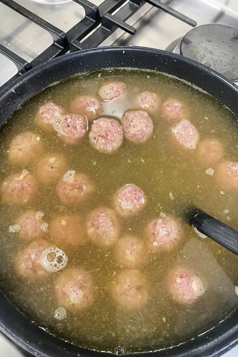 Soup meatballs cooking