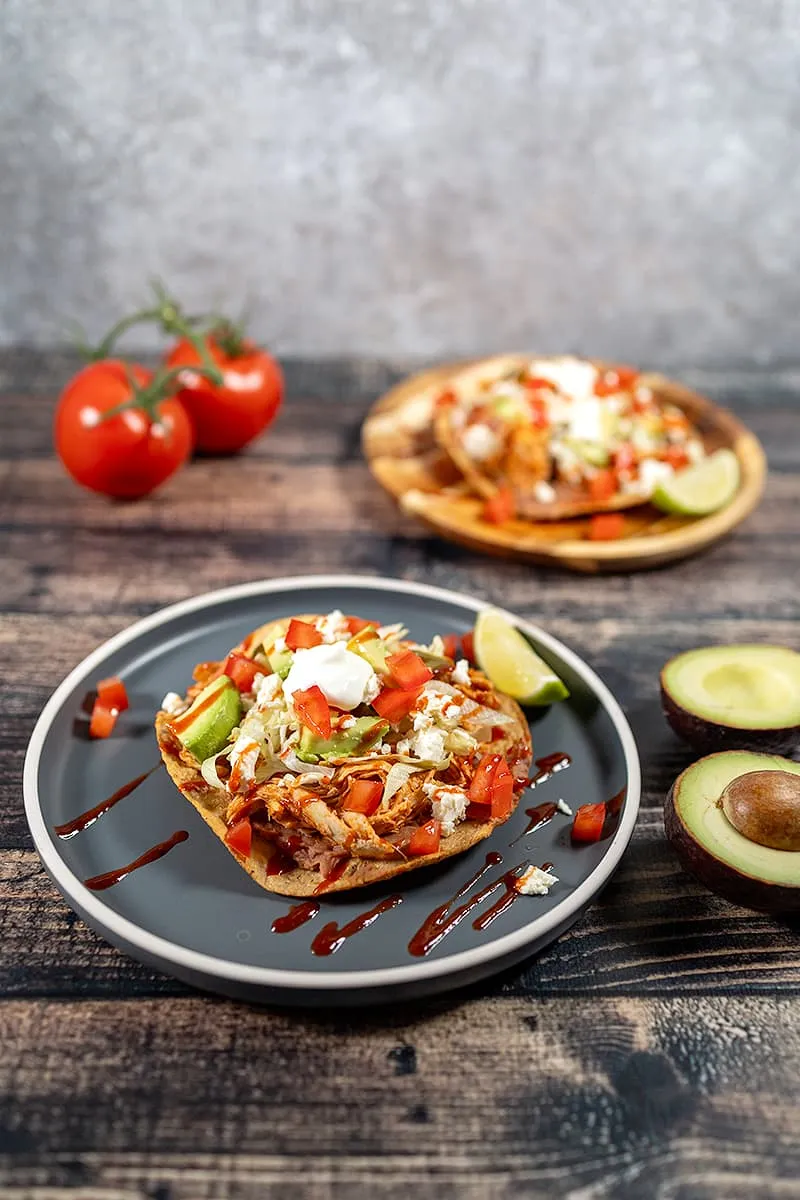 Chicken tostadas with beans - fried Mexican tortillas