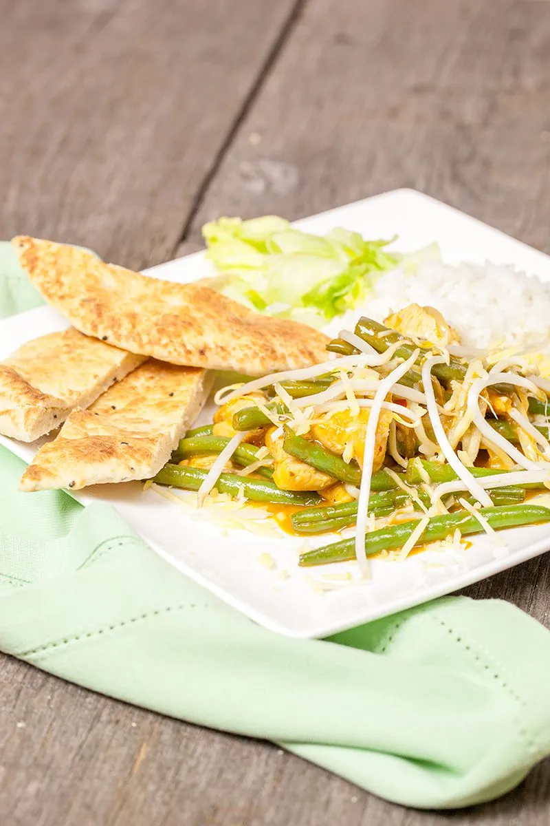 Sweet and sour chicken with naan bread