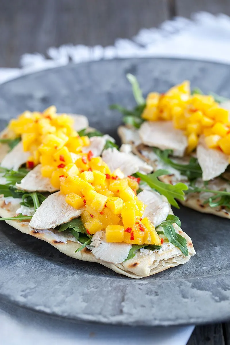 Mango and chicken with goat cheese on naan bread