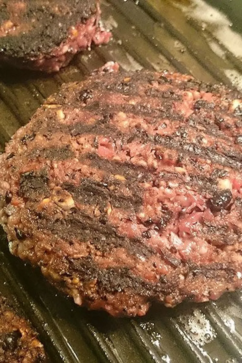 Cooking red beet burgers in grill pan