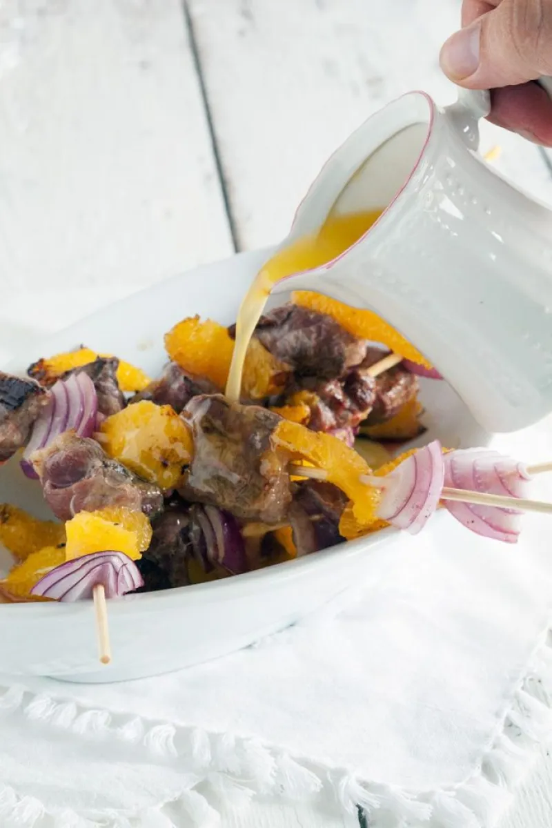 Duck kebabs with orange butter sauce