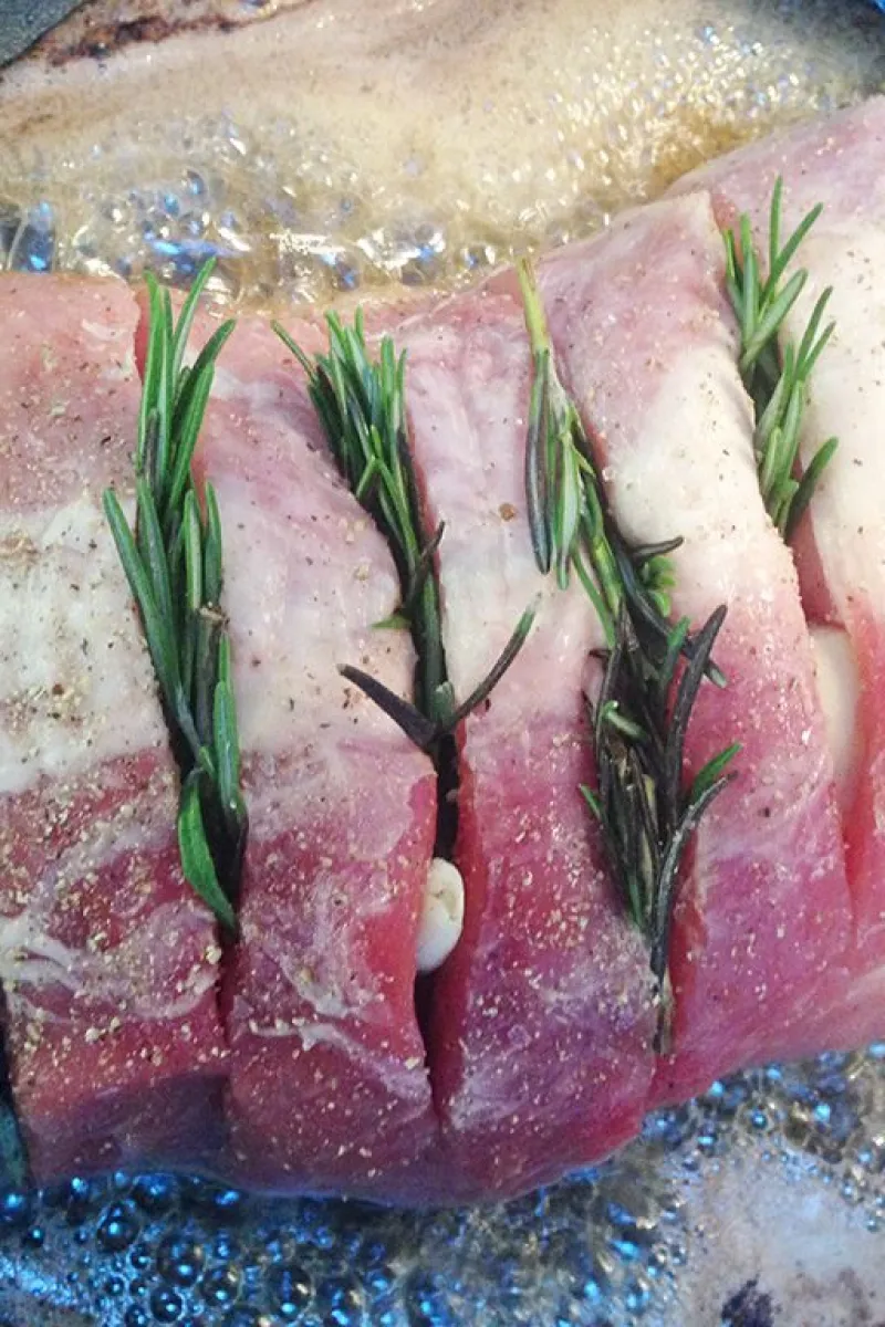 Oven-roasted pork loin with rosemary and potatoes preparation