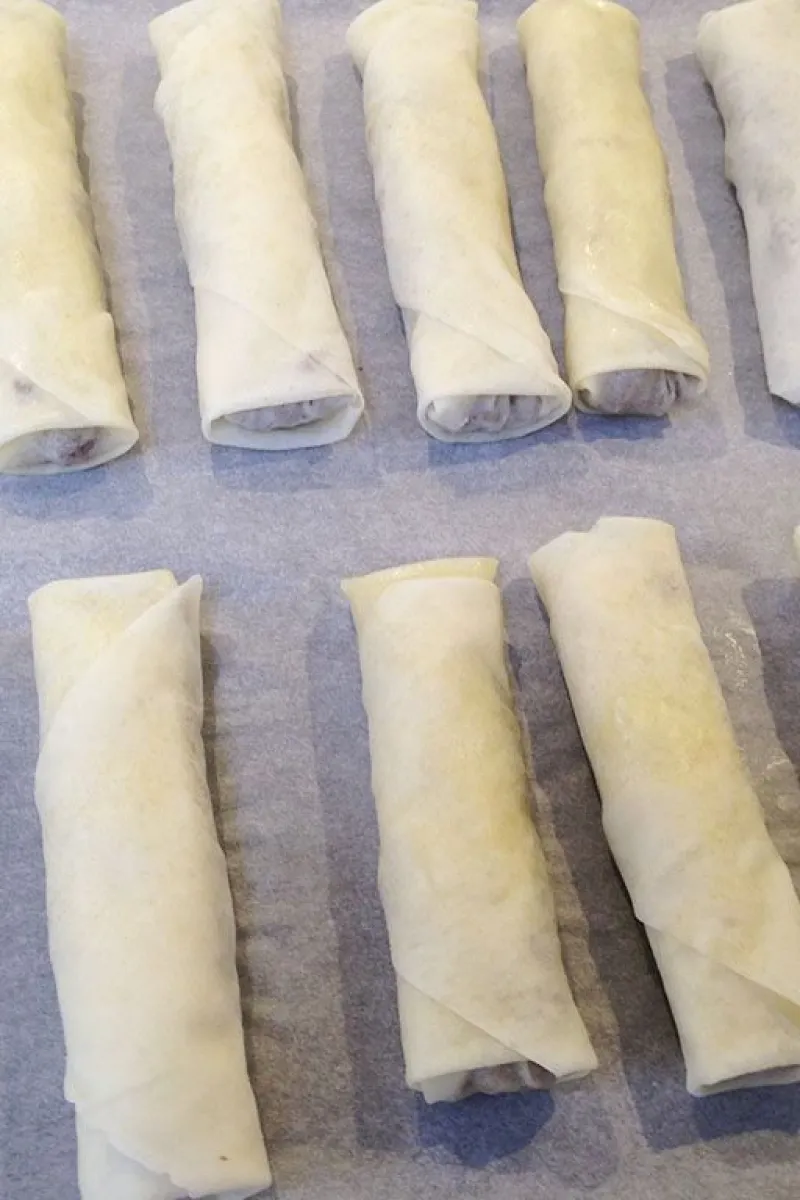 Folding spiced ground beef phyllo dough rolls