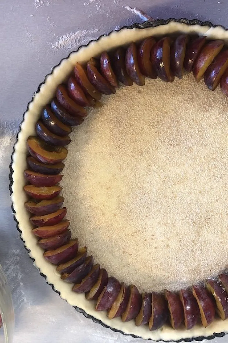Making the Dutch plum pie
