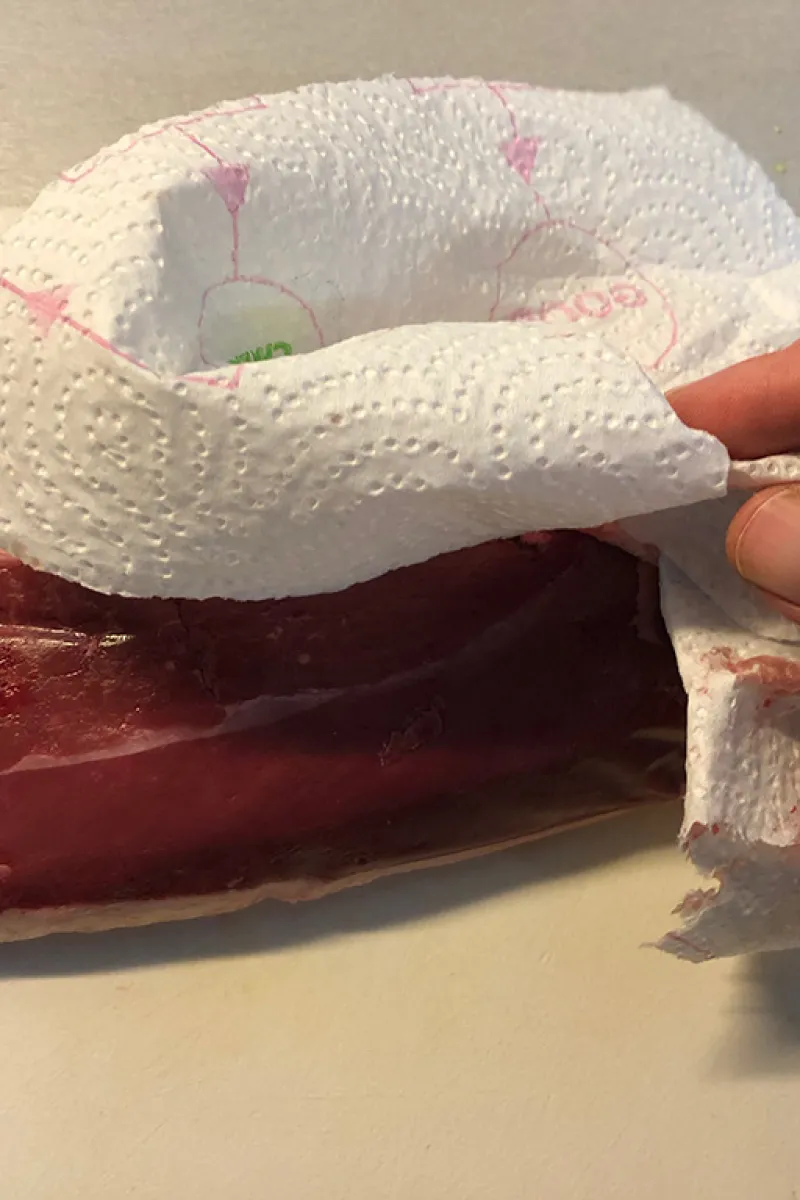 Pat the duck breast dry using paper kitchen towel
