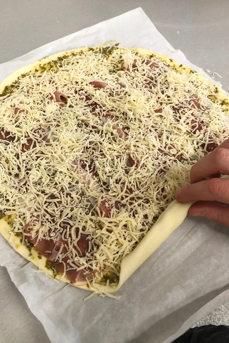 Rolling the ham and cheese pinwheels