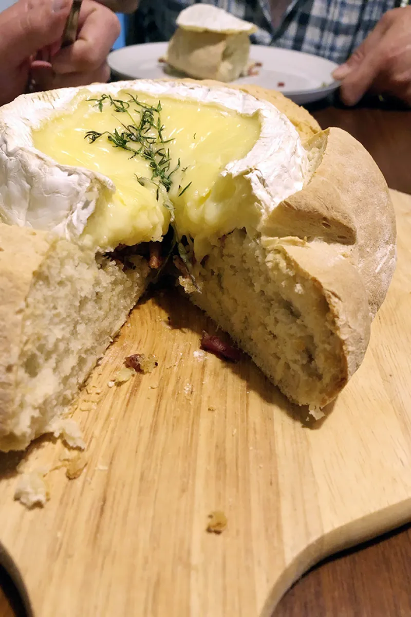 Baked camembert in bread oven