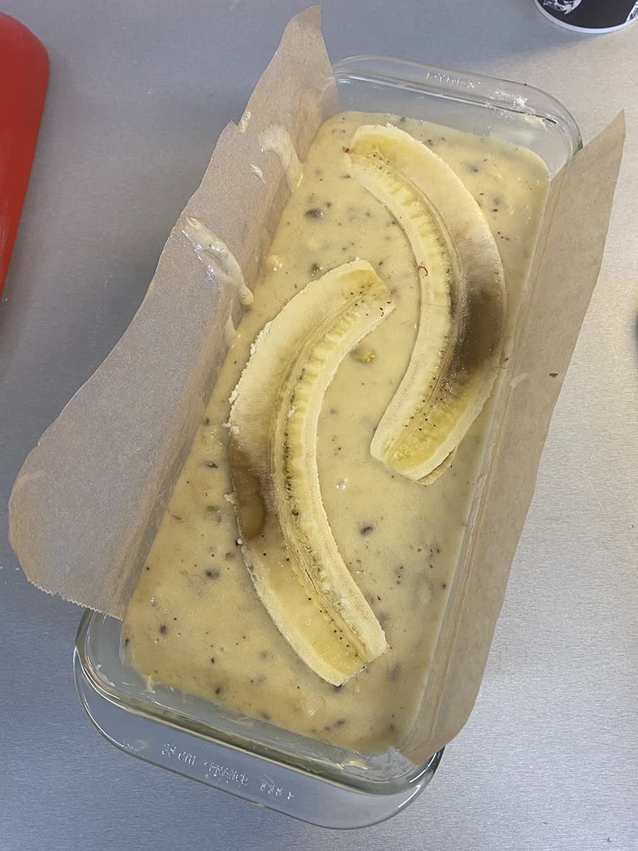 Halved bananas on top of the banana bread
