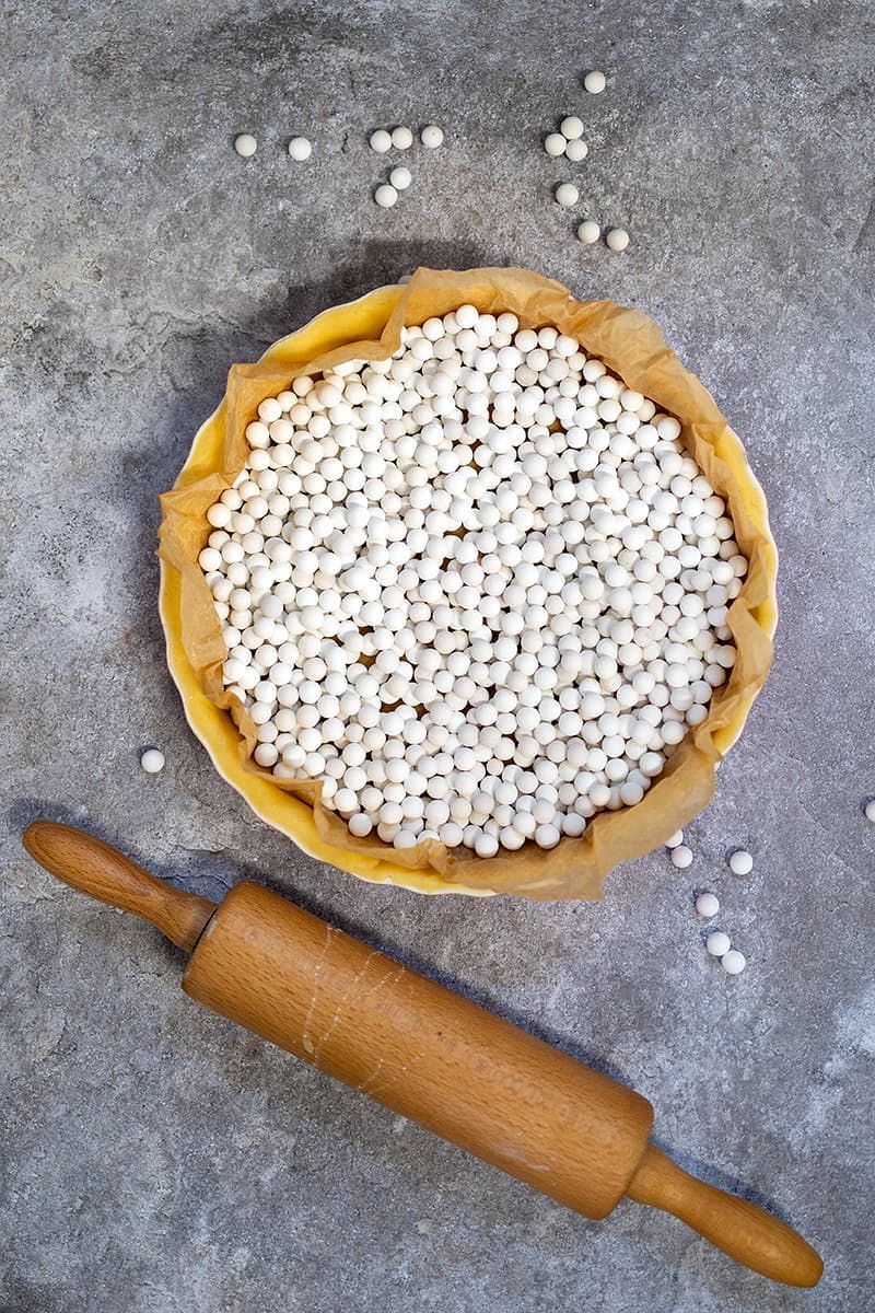 Blind baking beans on top of a basic pie crust