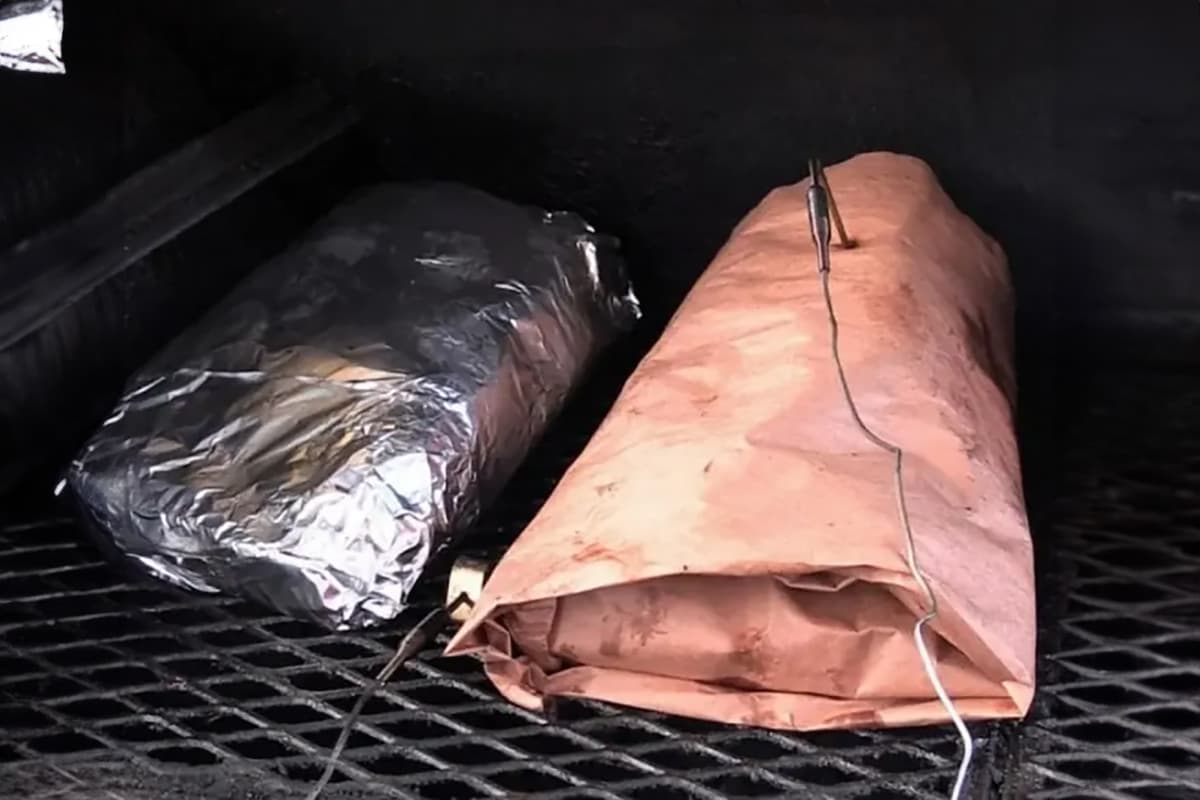 Wrapping a brisket on the barbecue