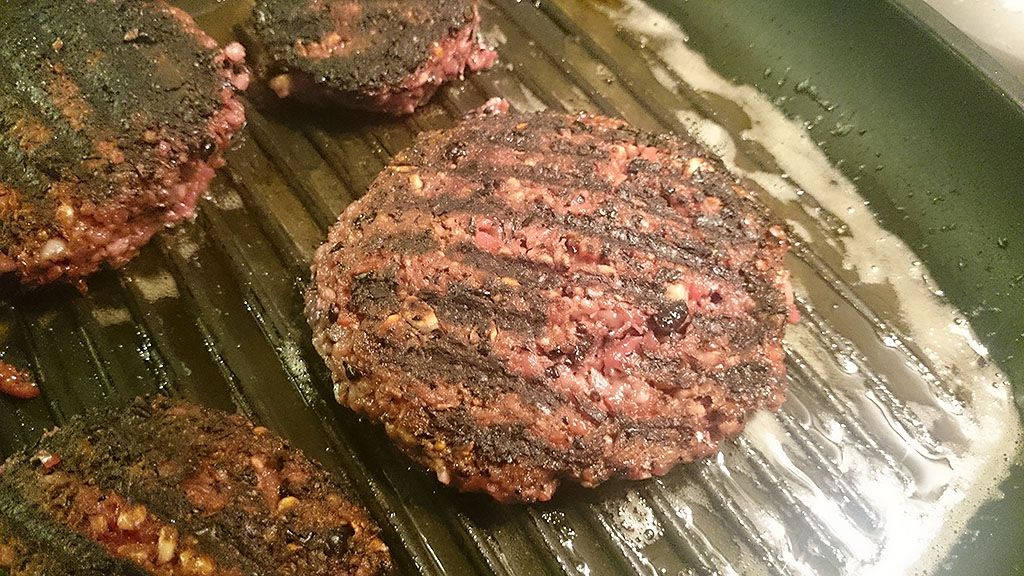 Cooking red beet burgers in grill pan
