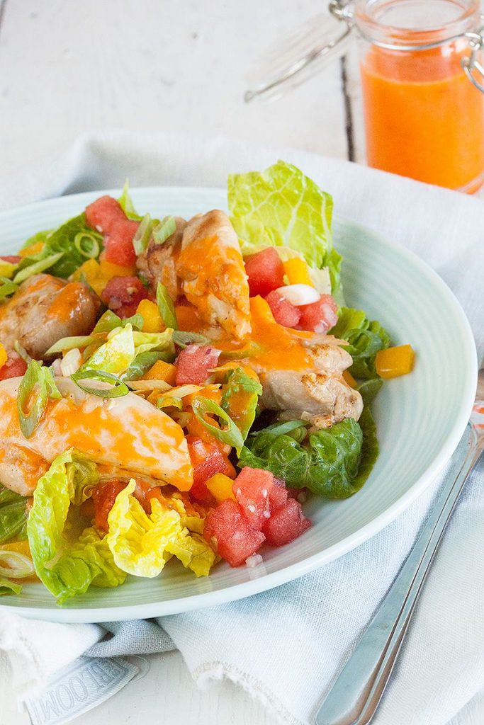 Salad with marinated chicken thighs and watermelon