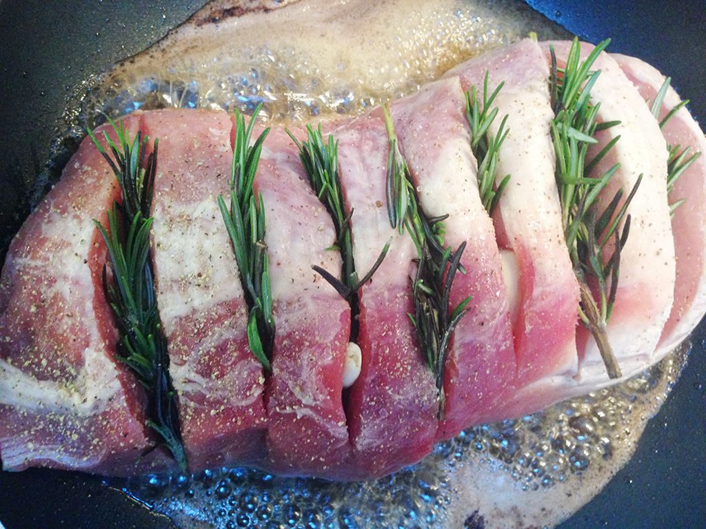 Oven-roasted pork loin with rosemary and potatoes preparation