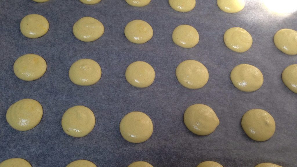 Lemon macarons before they go into the oven