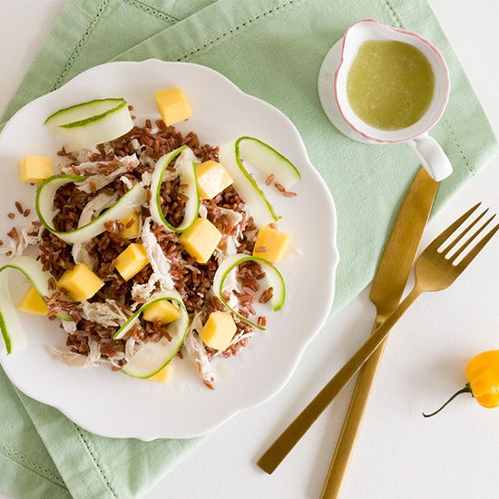 Spicy red rice salad with chicken and mango