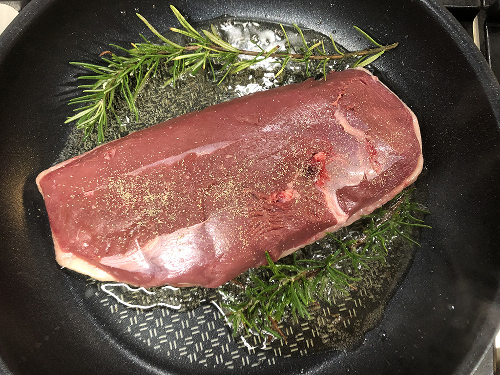 Fresh herbs are used to cook the duck breast