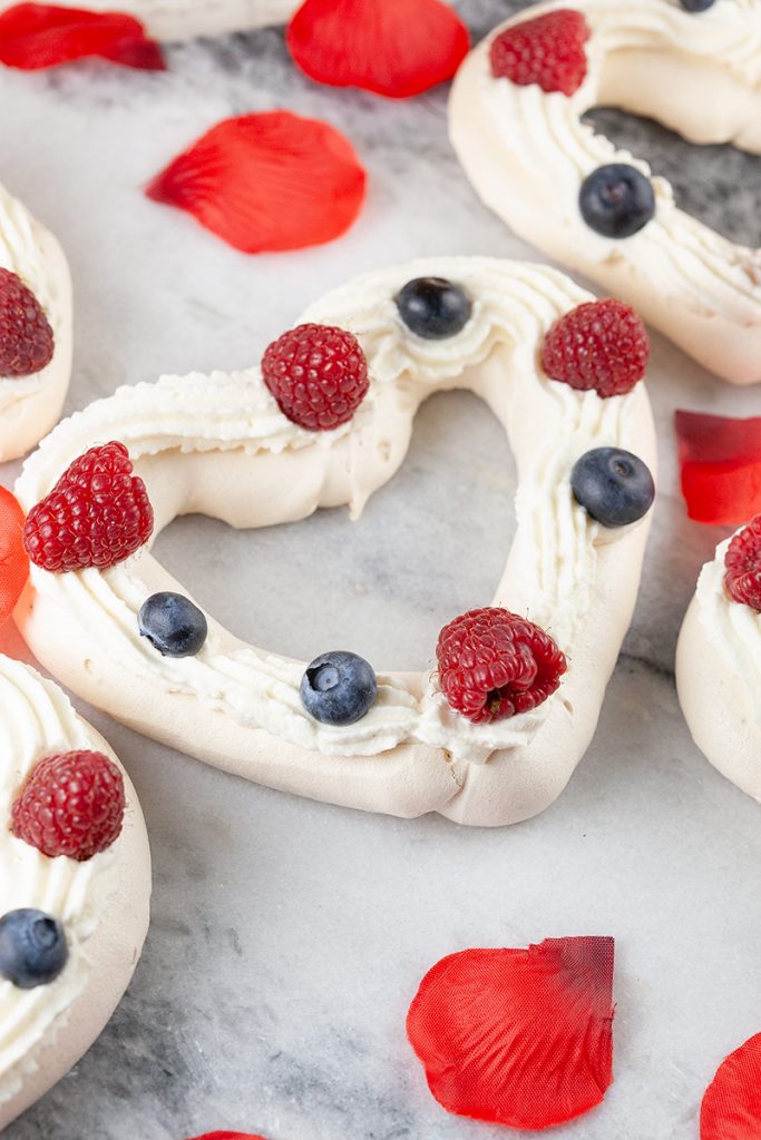 Valentines pavlovas with red fruits