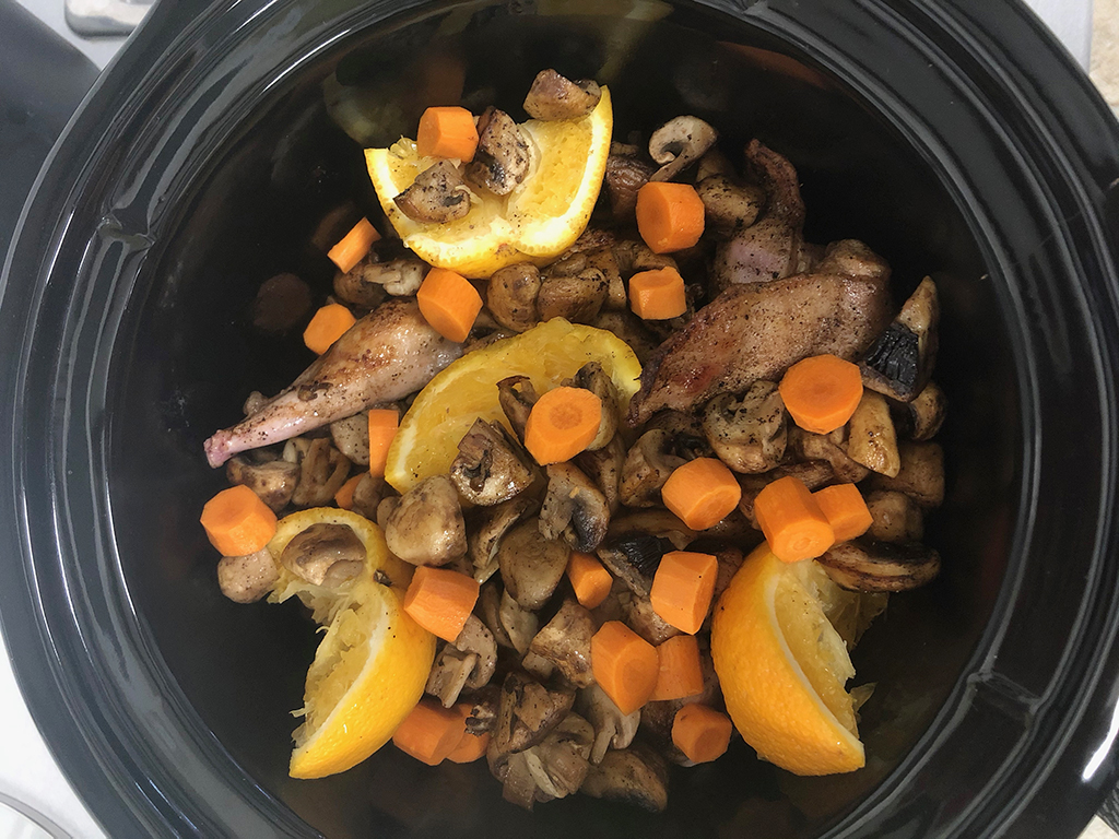 Slow cooker rabbit and orange stew preparation